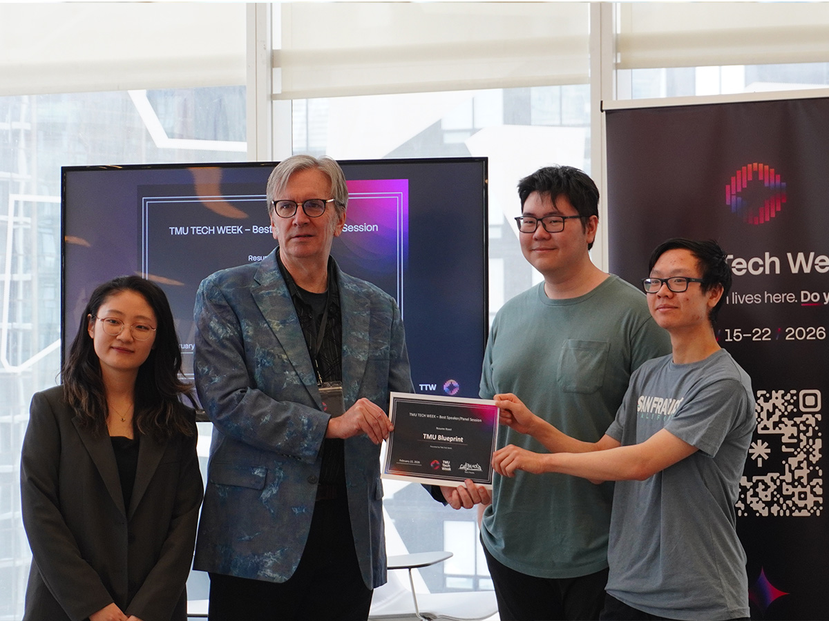 Prof. Lawrence Kolasa presenting a certificate to students