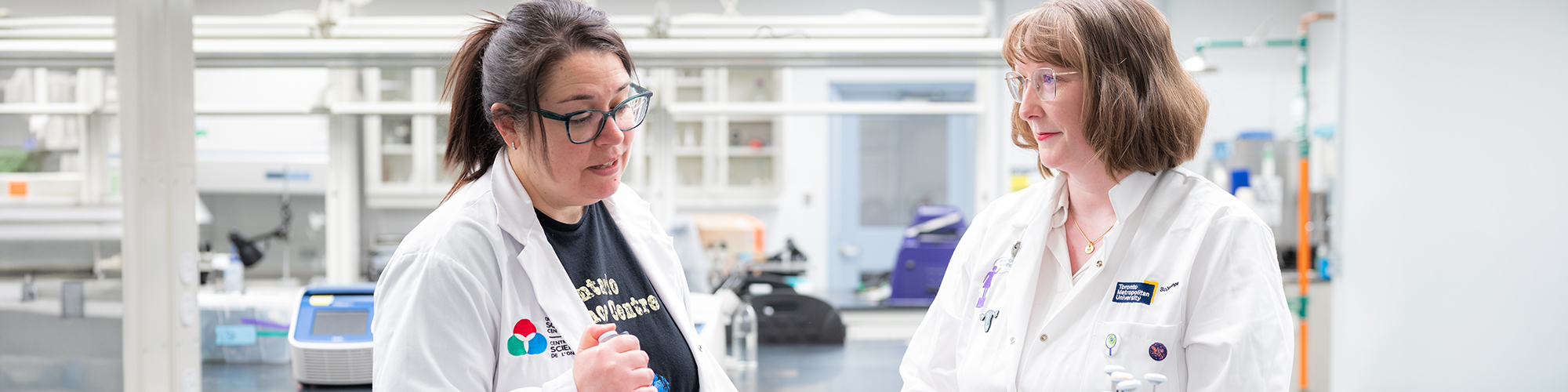 OSC staff and SciXchange staff collaborating in a lab