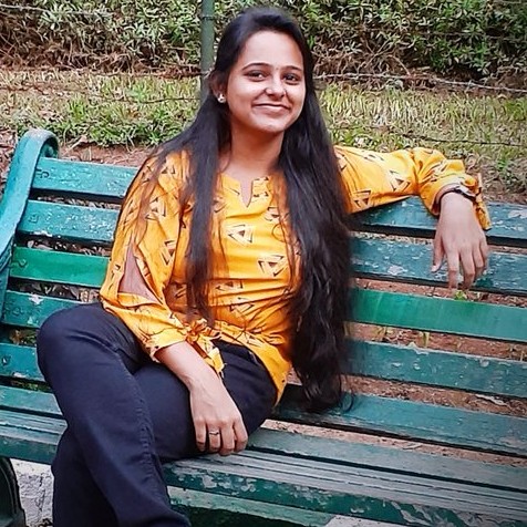 Anusha Ravikumar sitting on a bench