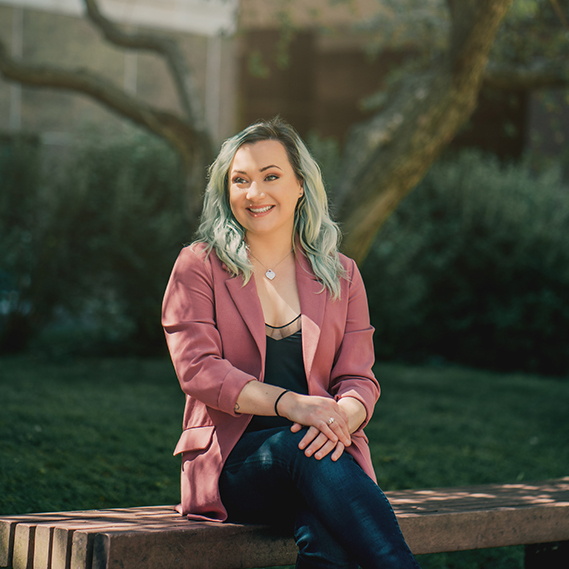 Dr. Erin Meger sitting on a bench