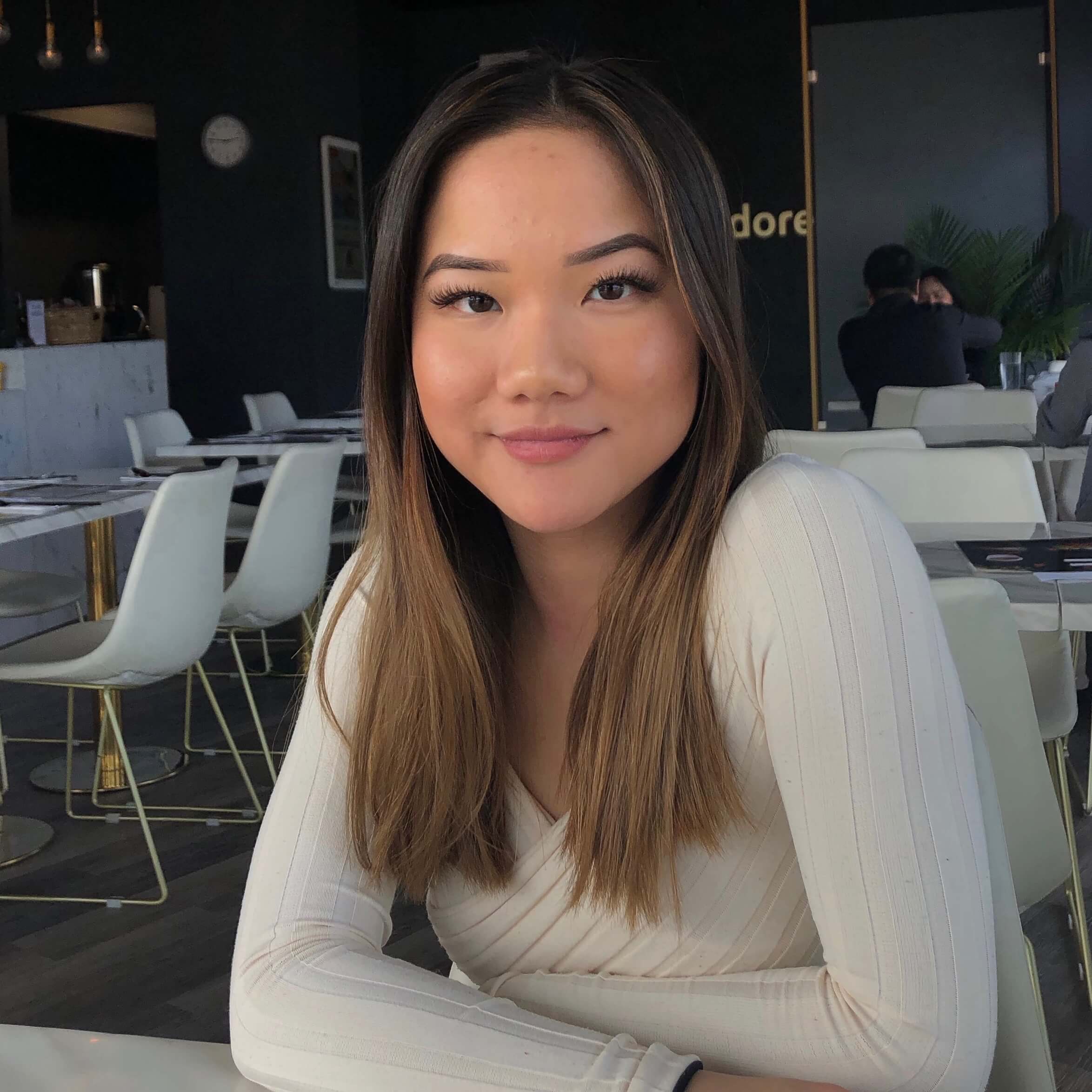 Taylor sitting at a table for a photo.