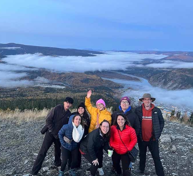 Students at the Midnight Dome, overlooking Dawson City, Klondike Valley and the Yukon River.