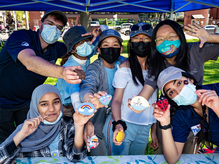 Group of 7 people wearing masks 