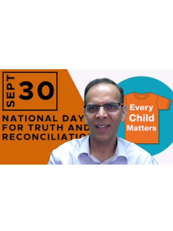Abdul Gilzay in front of 'Every Child Matters' background
