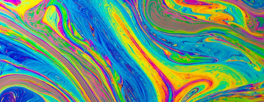 an abstract swirl of rainbow colours