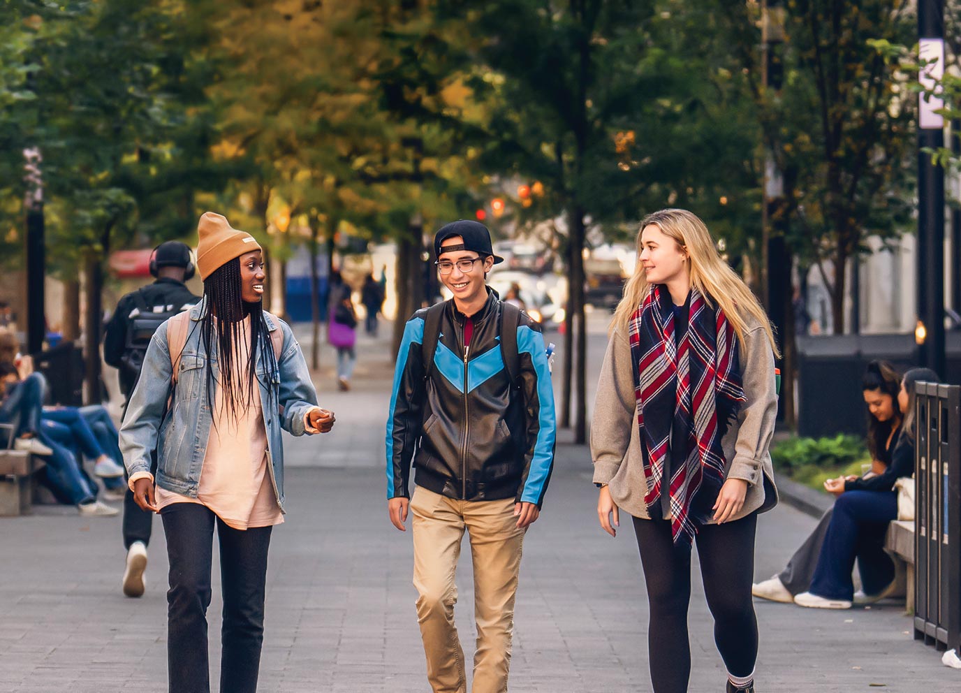 Students walking in the autumn on TMU campus