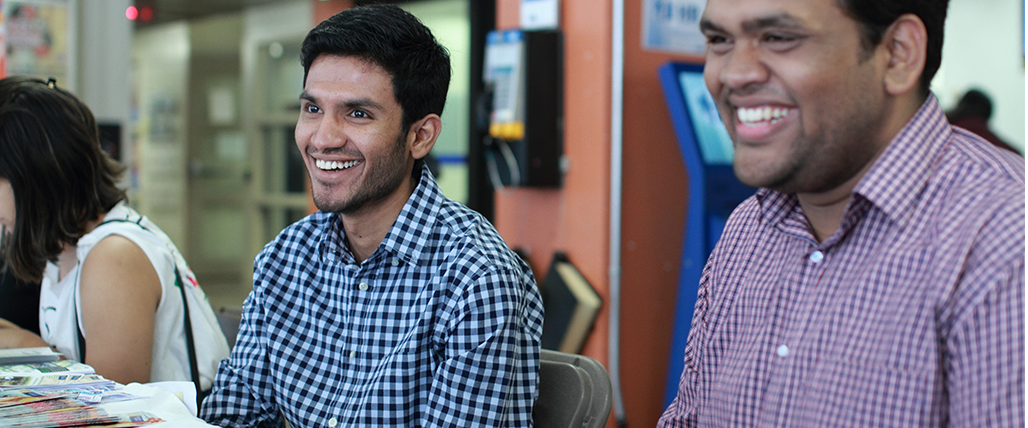 Two students enjoying themselves at an event