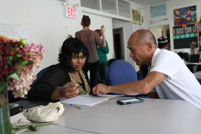 A faculty member helping a student