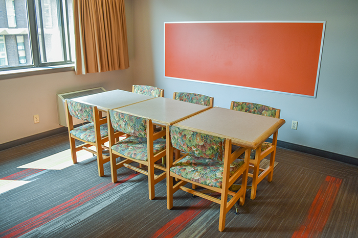 Eating area with a table and chairs in the ILC floor lounge