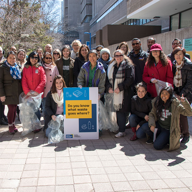 Staff take part in a campus clean-up sustainability awareness event.