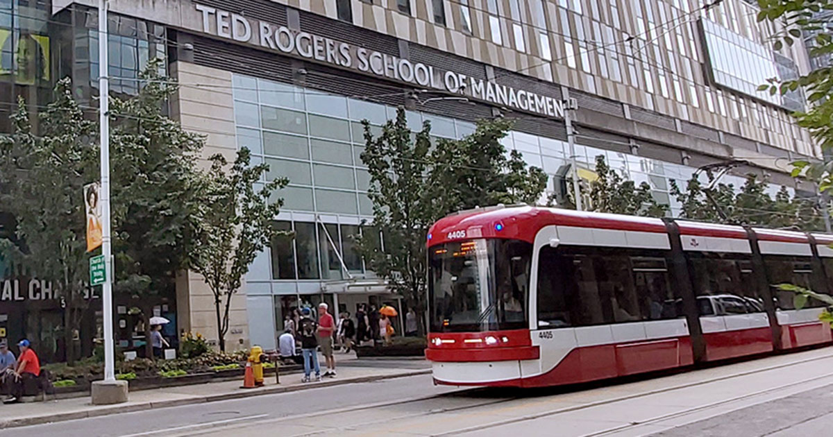 A streetcar passes by TMU's Ted Rogers School of Management.