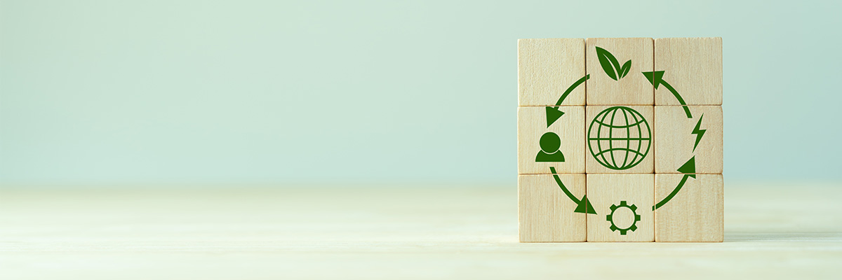 A photograph of building blocks stacked to create a circular economy emblem.