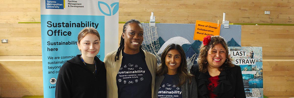 Sustainability Office employees and a volunteer pose for a photo at a Water Day event.