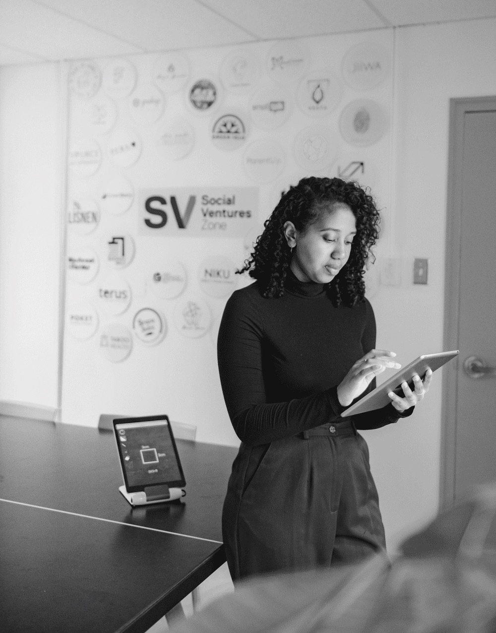 Angelique Paul, Founder of In-Touch, working on a tablet