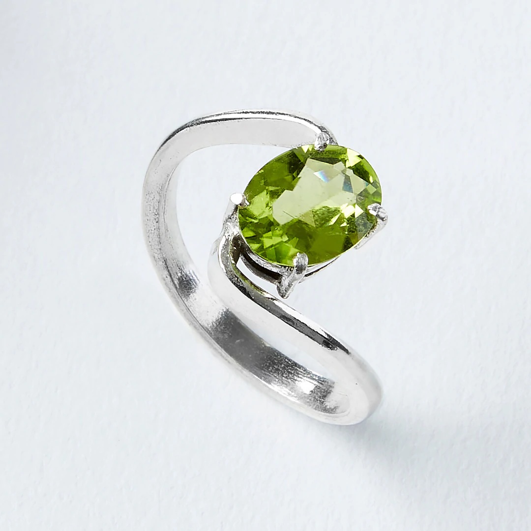 Silver ring with green gemstone