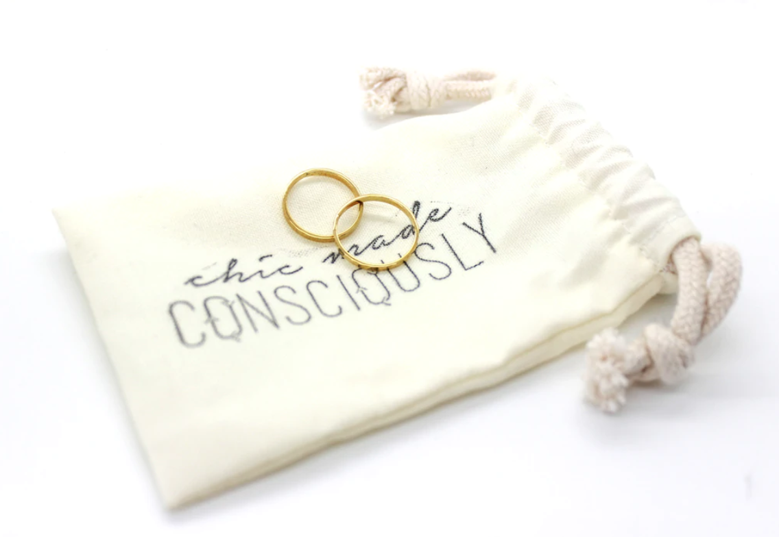 Small jewelry bag with two gold rings on top