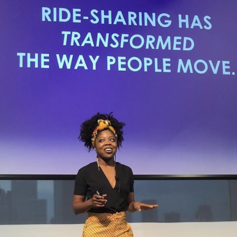 Founder Aisha speaking at a pitch competition