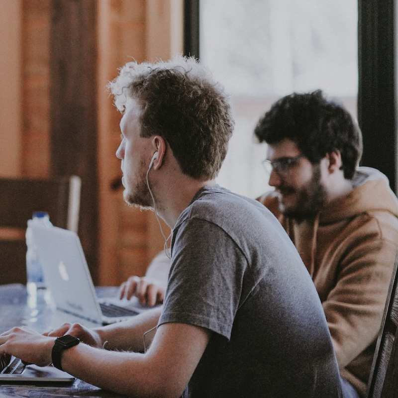 two men working together