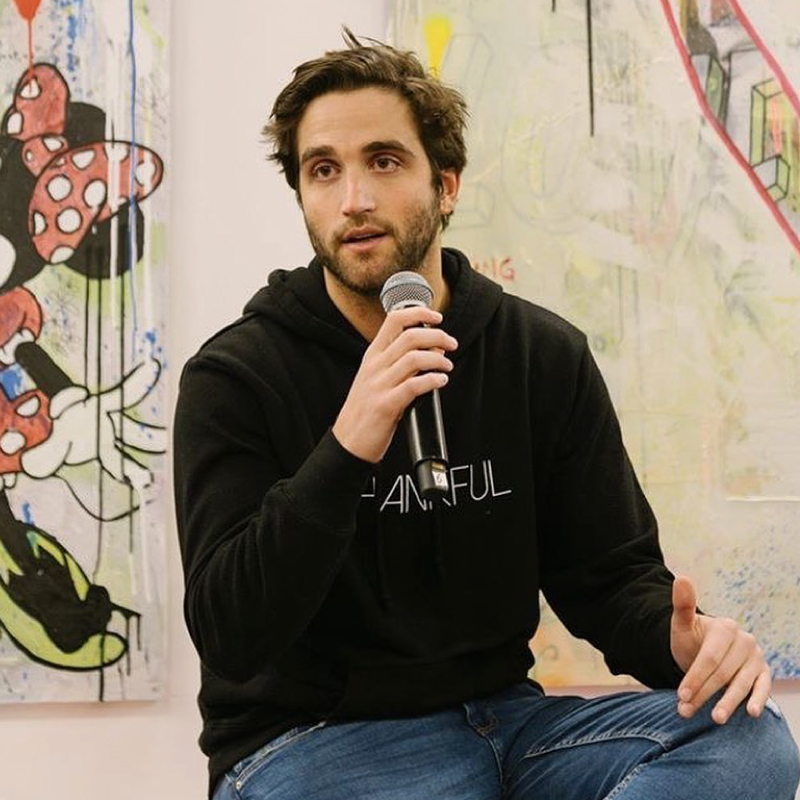 Founder Eli Brown talking in a microphone