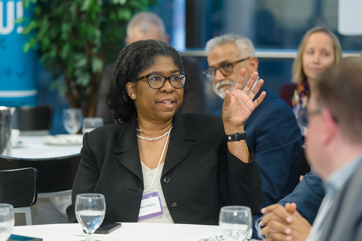 Darlene Dasent raising her hand to speak at the advisory council meeting