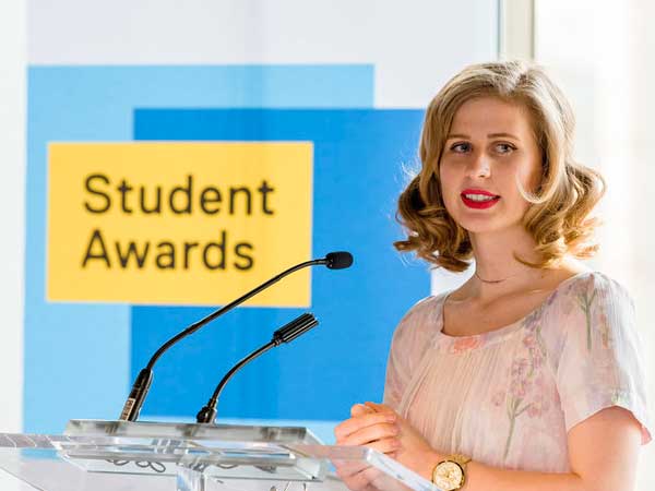 Tara Upshaw student award recipient at a podium