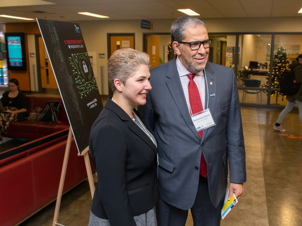 Mohamed Lachemi standing with the CRL's founder Atefeh Mashatan.