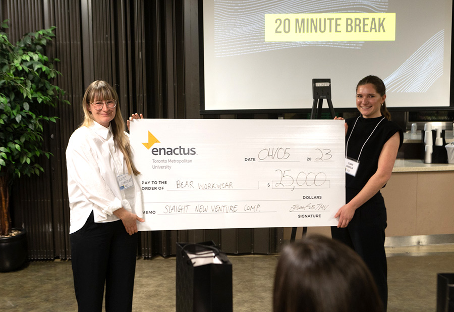 Claire Chisholm receiving a $25,000 large cheque