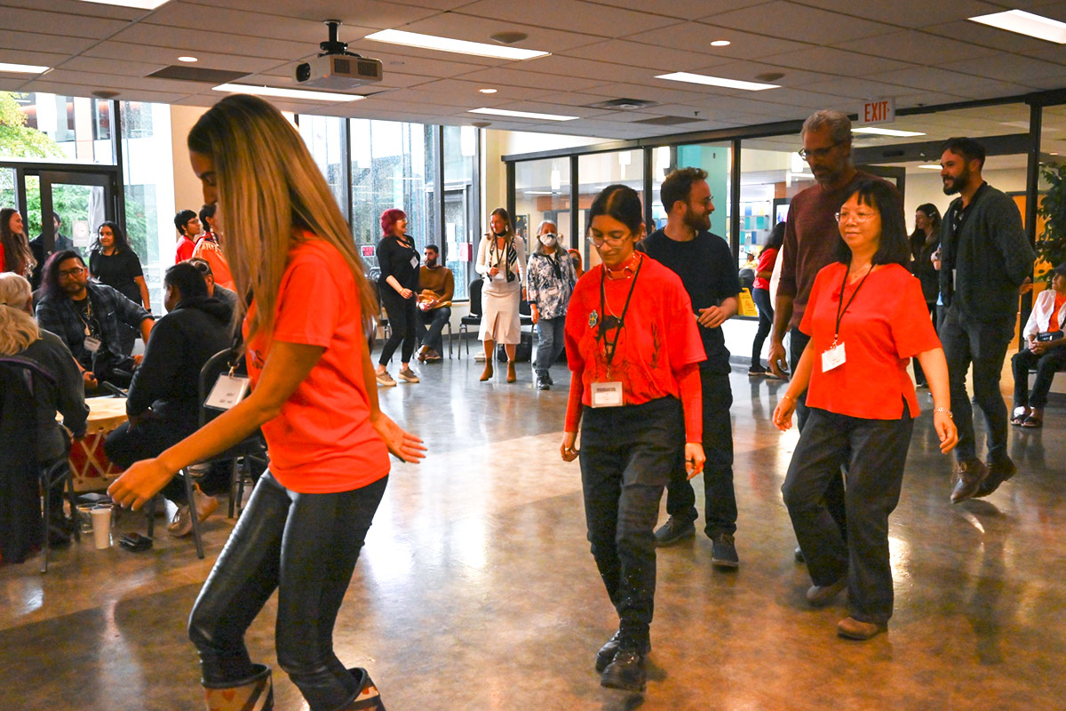 Staff participating in a dance at the Reconciliation in Business 2023 Conference