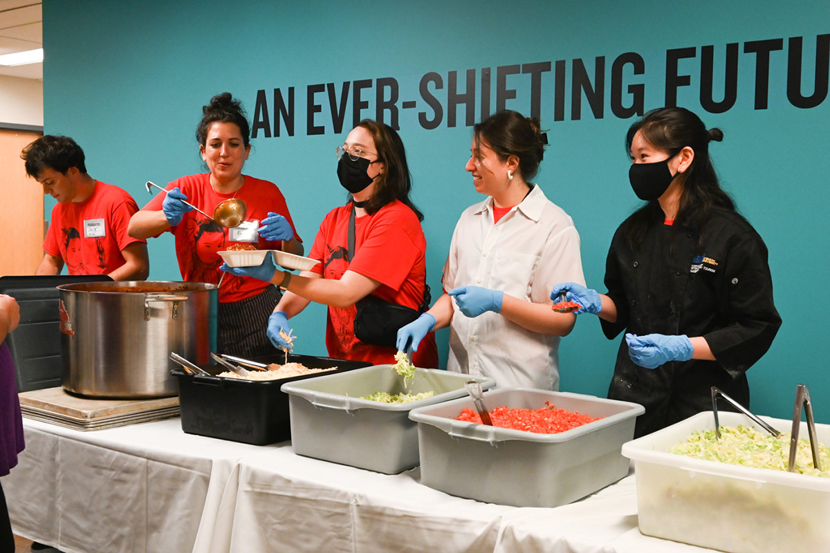 Staff serving food at the Reconciliation in Business 2023 Conference