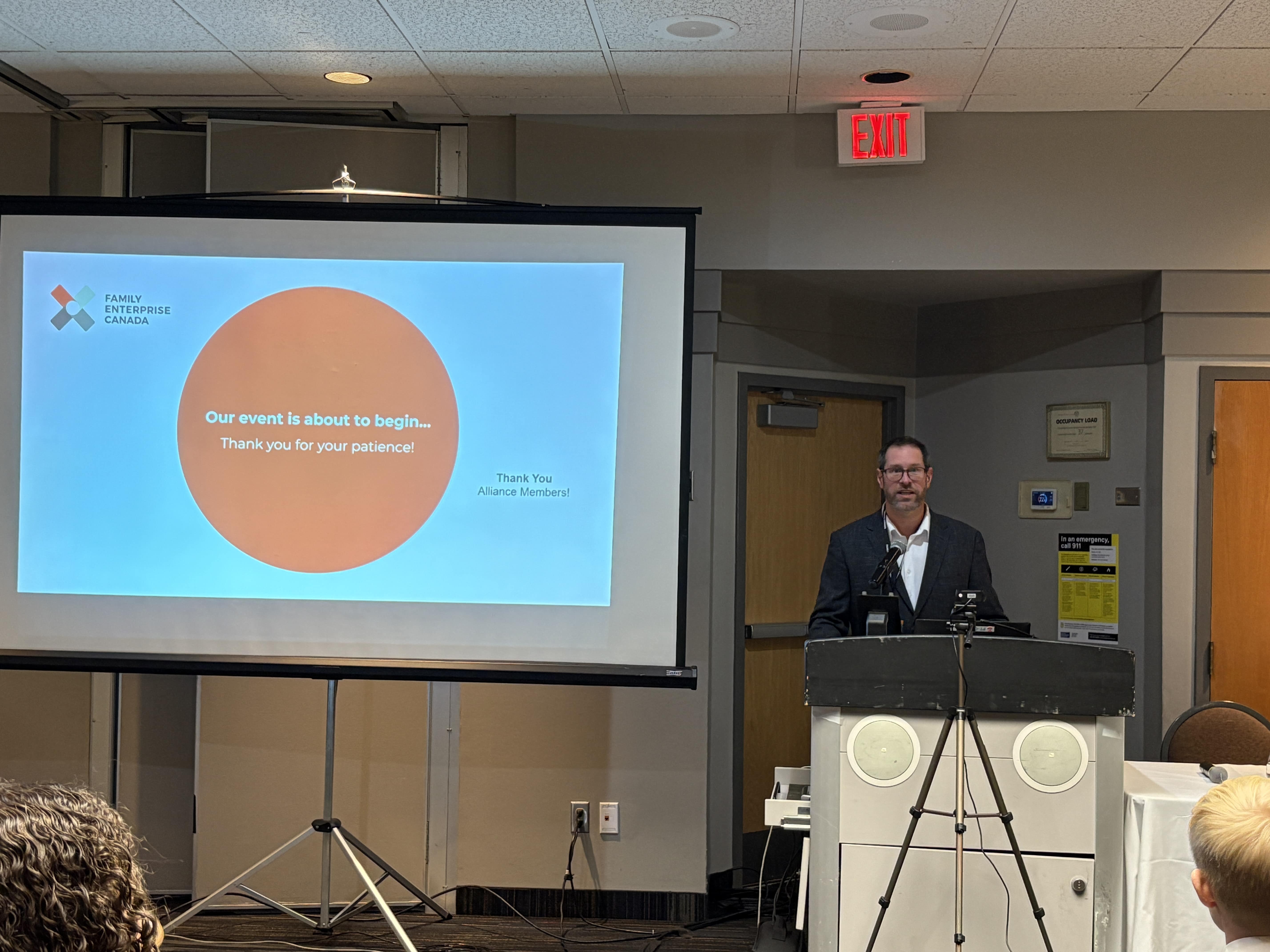 Steve Beauschene speaking at a podium.