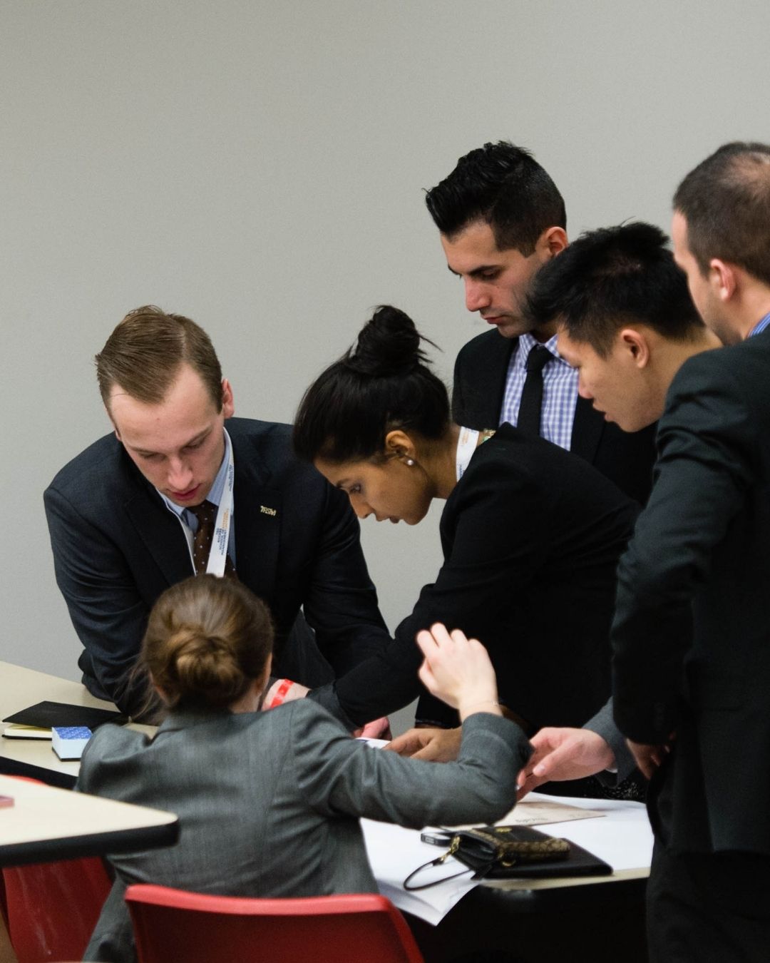 students in business professional in a discussion