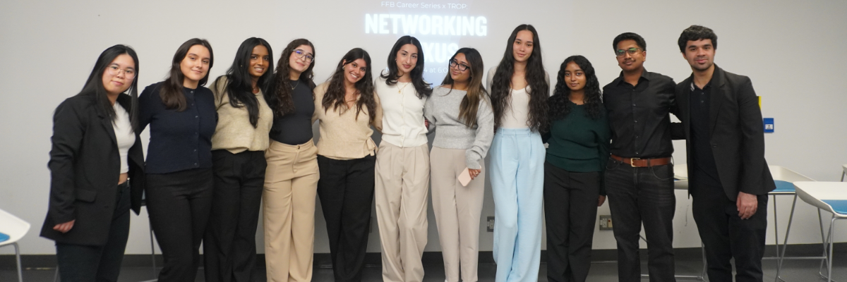Student leaders in a single line smiling at camera
