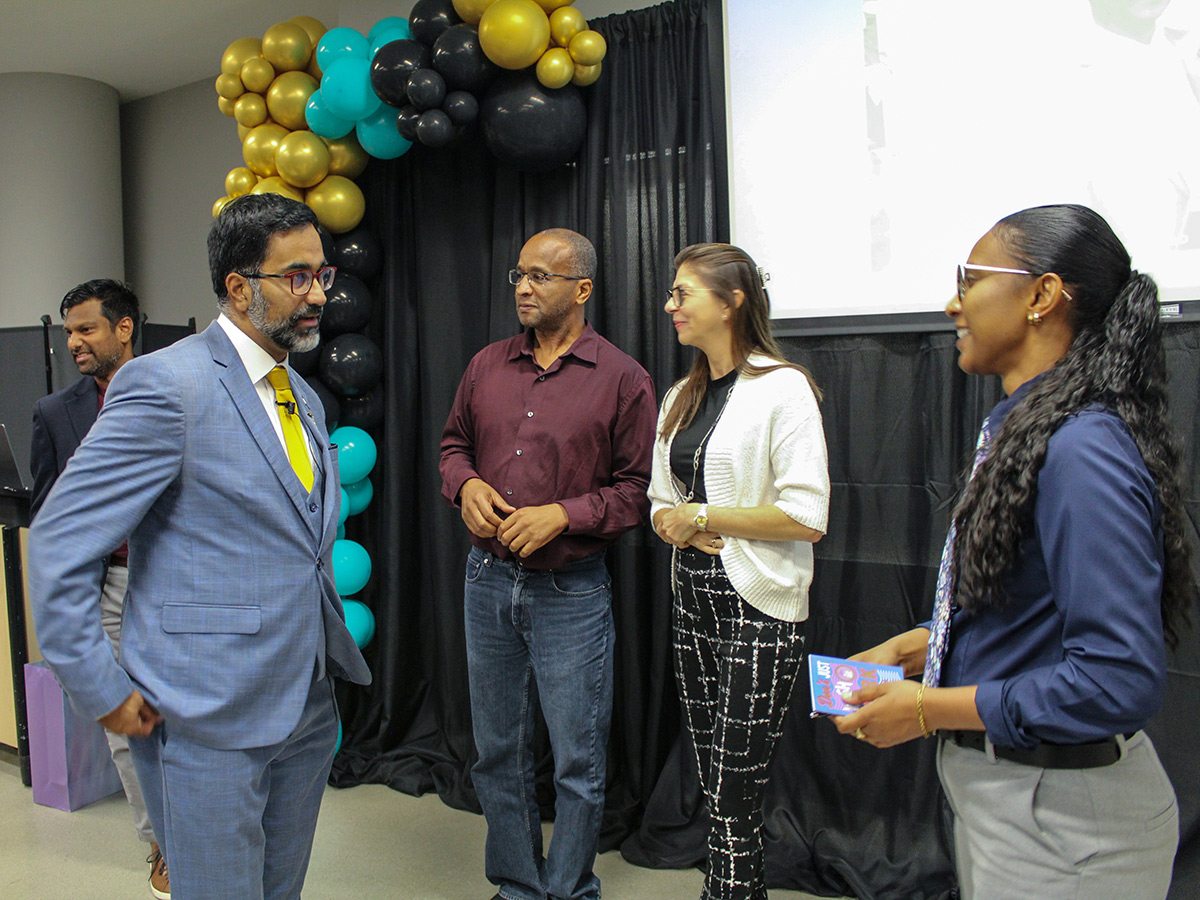 Winston Isaac Lecture event - attendees talking and attending presentation