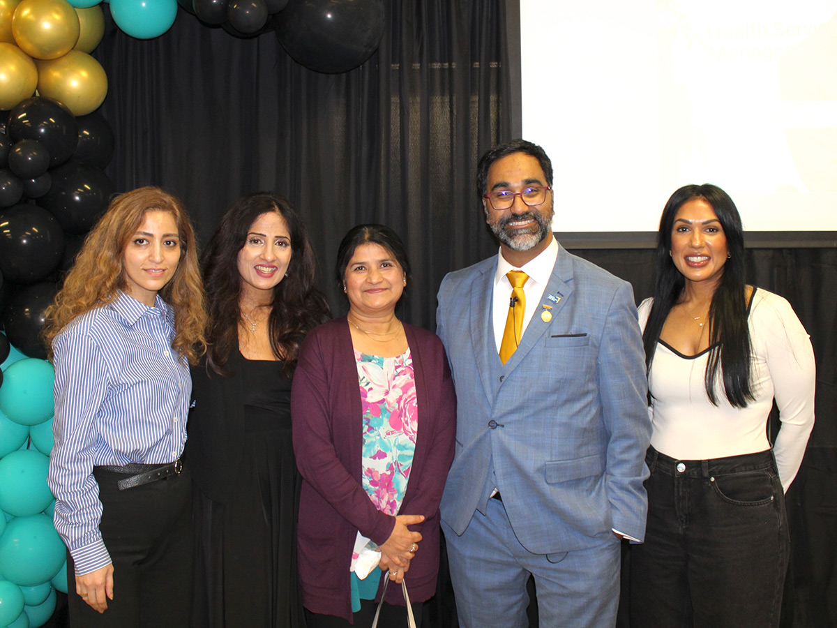 Winston Isaac Lecture event - attendees talking and attending presentation