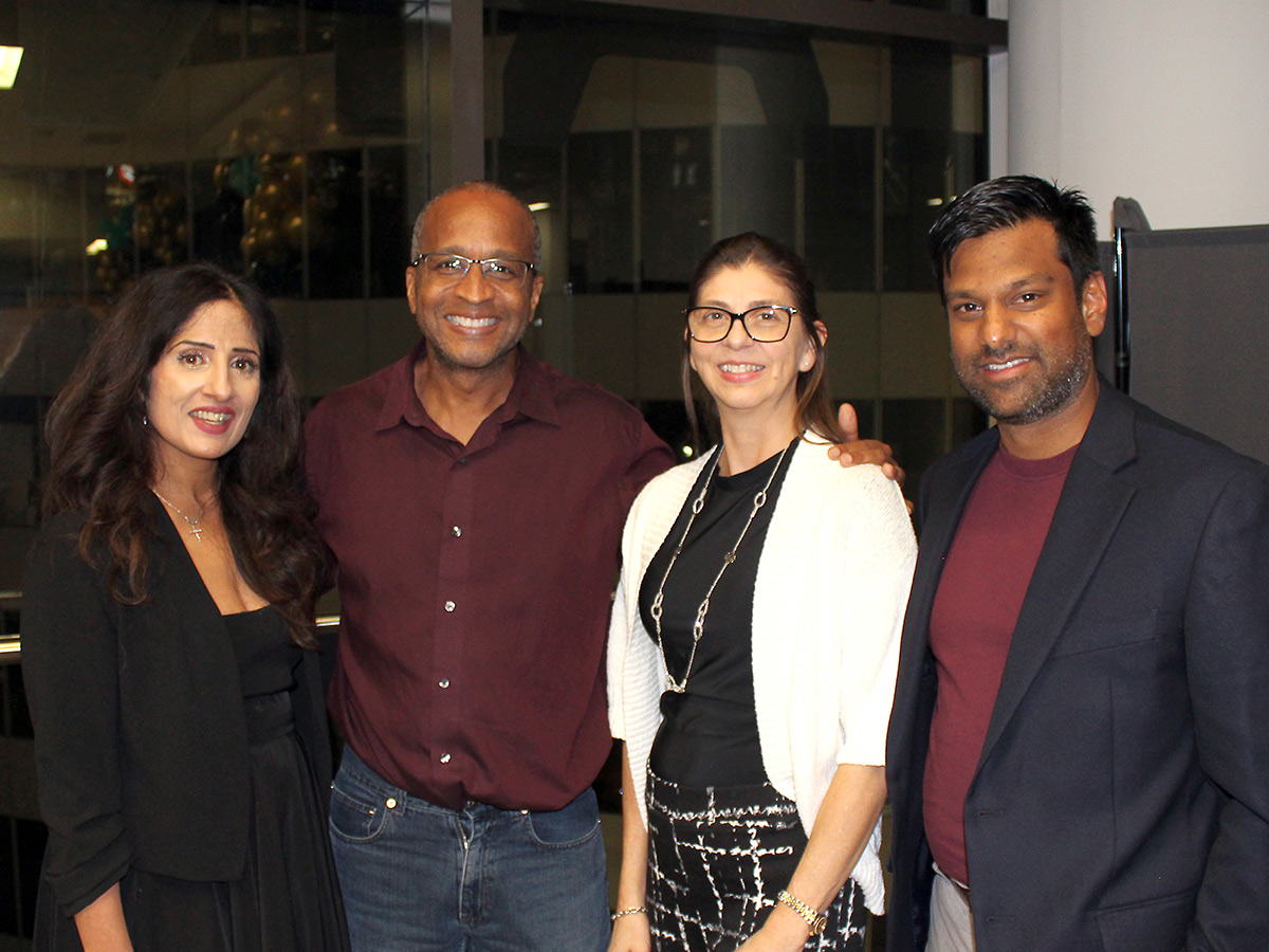 Winston Isaac Lecture event - attendees talking and attending presentation