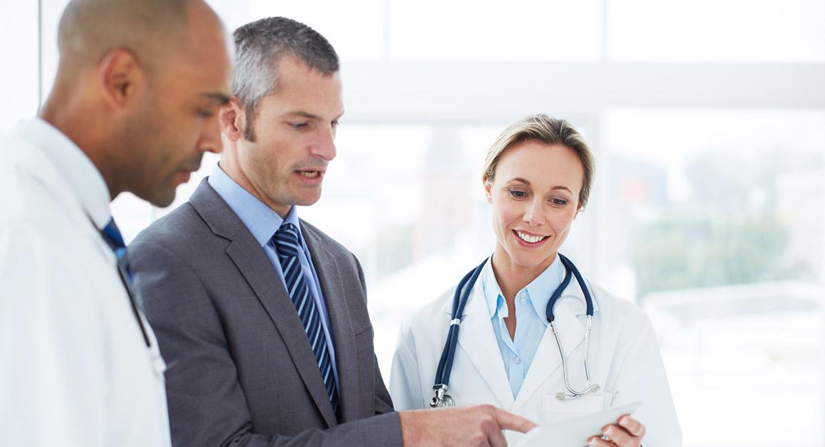 Health manager speaking with healthcare professionals like doctors