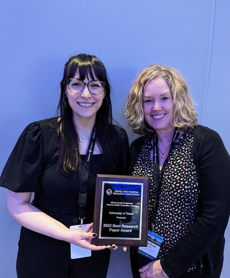 Rachel Dodds and a student holding an award.