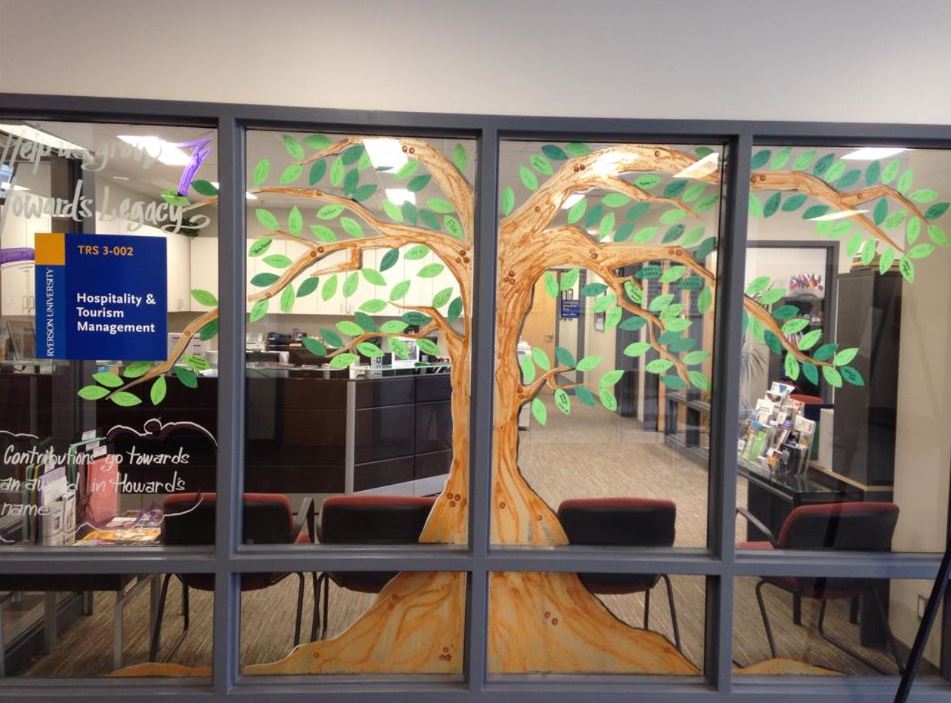 Image of the window decal of a large tree at the TRSM building