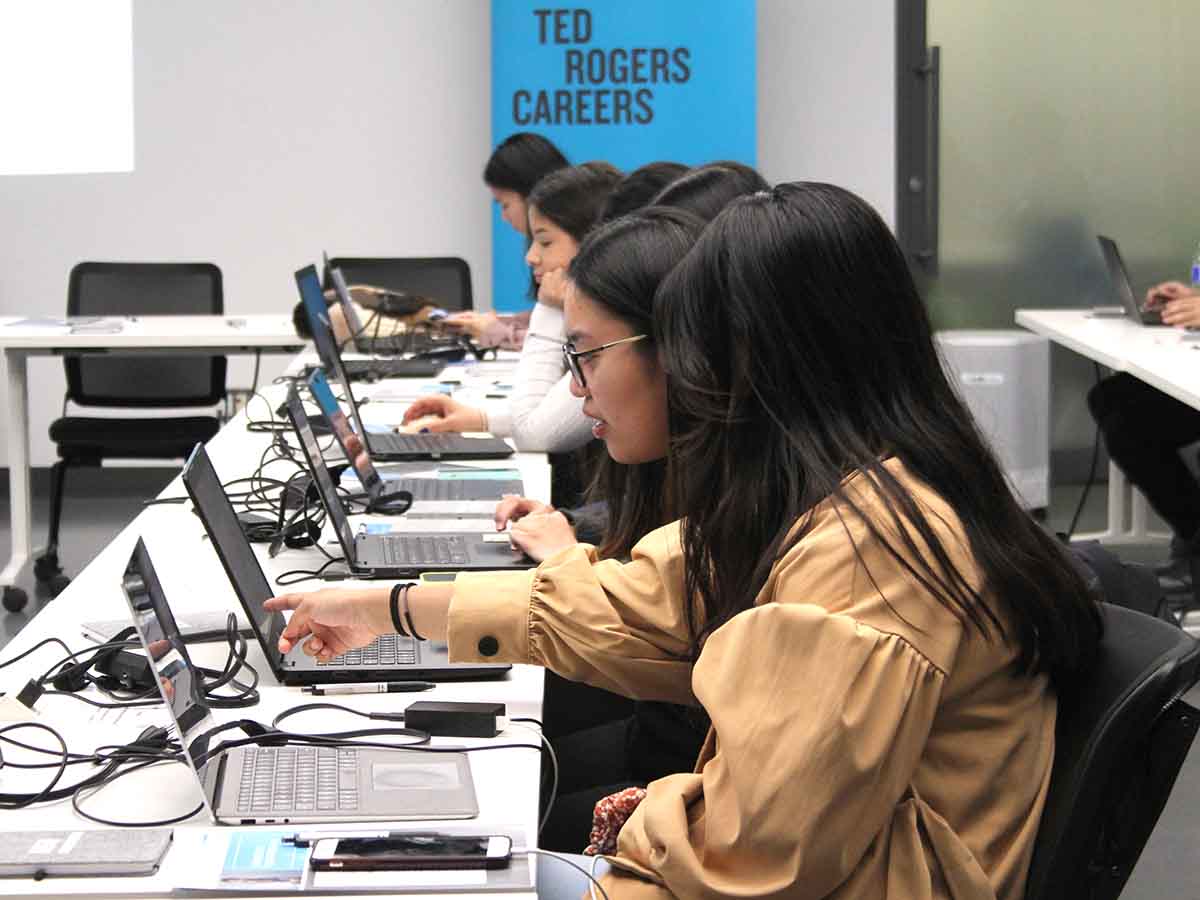 students sit at computers in Bootcamp Lab