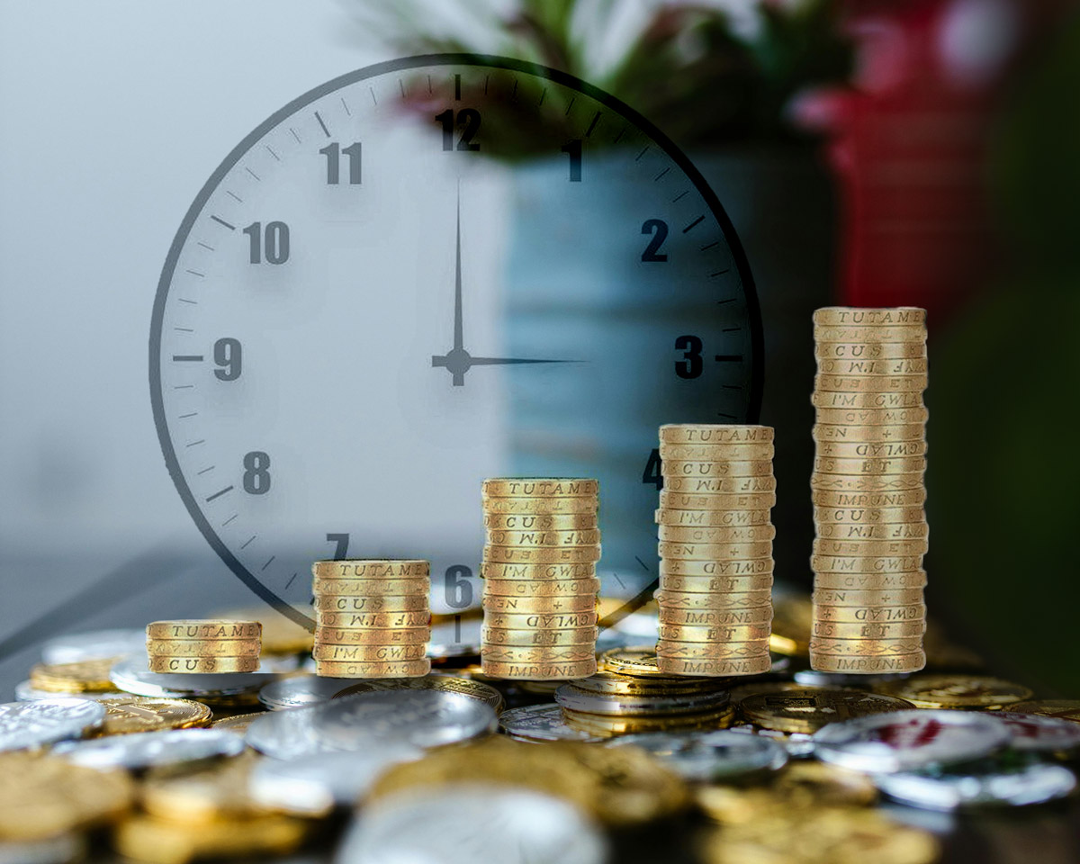 A transparent clock face overlays stacks of coins, ranging from short to tall. The image symbolizes market downturn.
