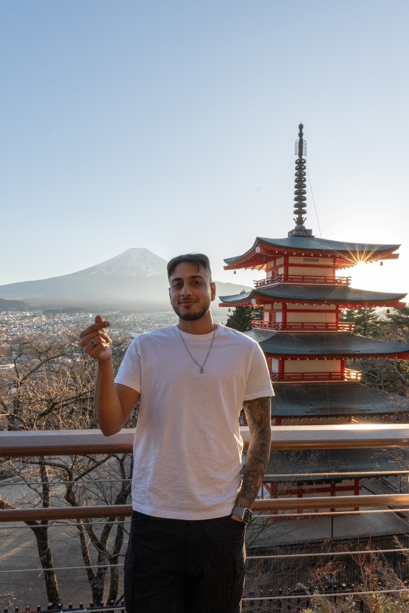 student posing in front of traditional architecture in South Korea