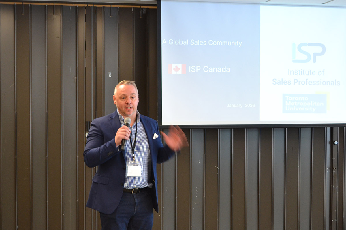  A presenter speaking to the CUSC audience, with a screen behind him.
