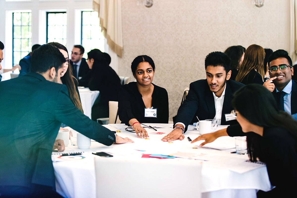group of students at a round table during the Top 200 Program summit 