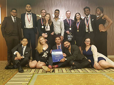 DECA team celebrating win at a competition