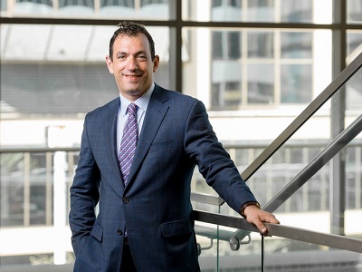 Rob Silver posing by a set of stairs