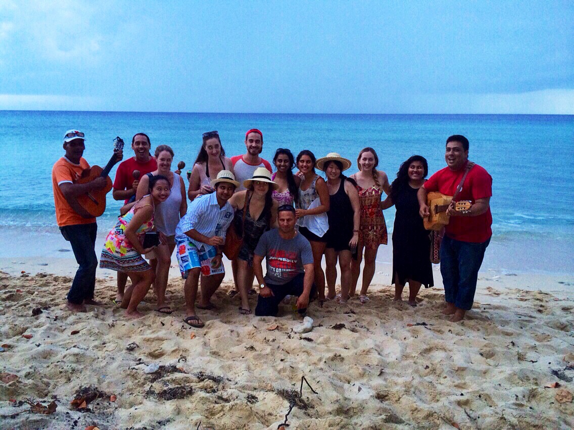 Students and faculty enjoying a day at the beach