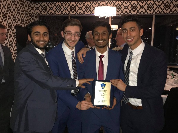 Excited case competition winners pose with their award