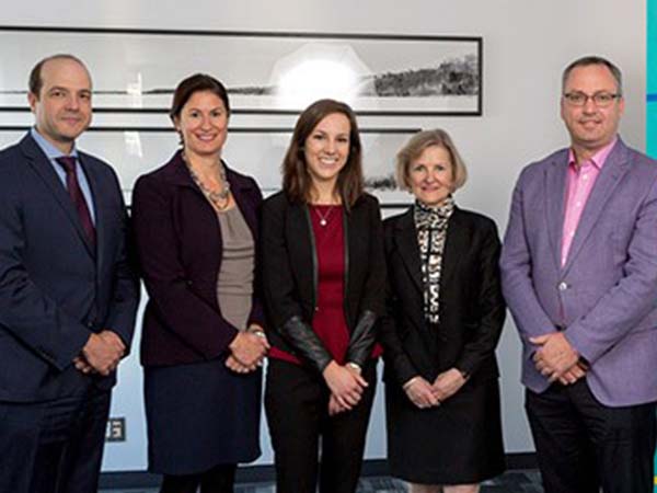 Dean and four faculty members pose 