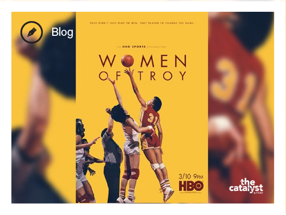 Movie Poster for "Women of Troy" - pictured are women in old school basketball jerseys getting ready for the tip off. The basketball replaces the 'o' in 'Women'.