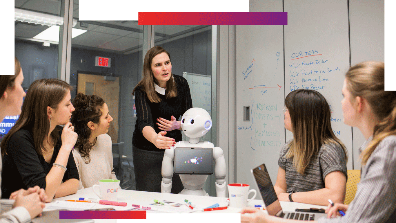 group of students and a professor working on a humaoid robot